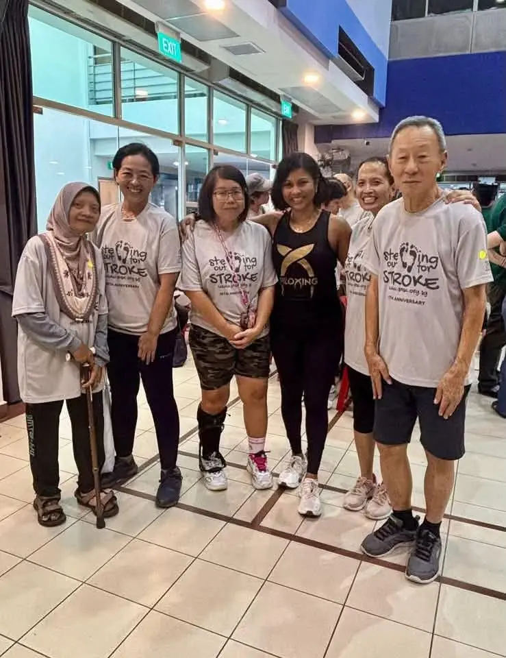 Maya Seah with fellow stroke survivors and community members at a supportive fitness gathering in Singapore